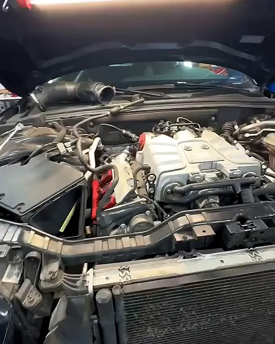 Audi supercharged V6 in the bay with the front clip removed